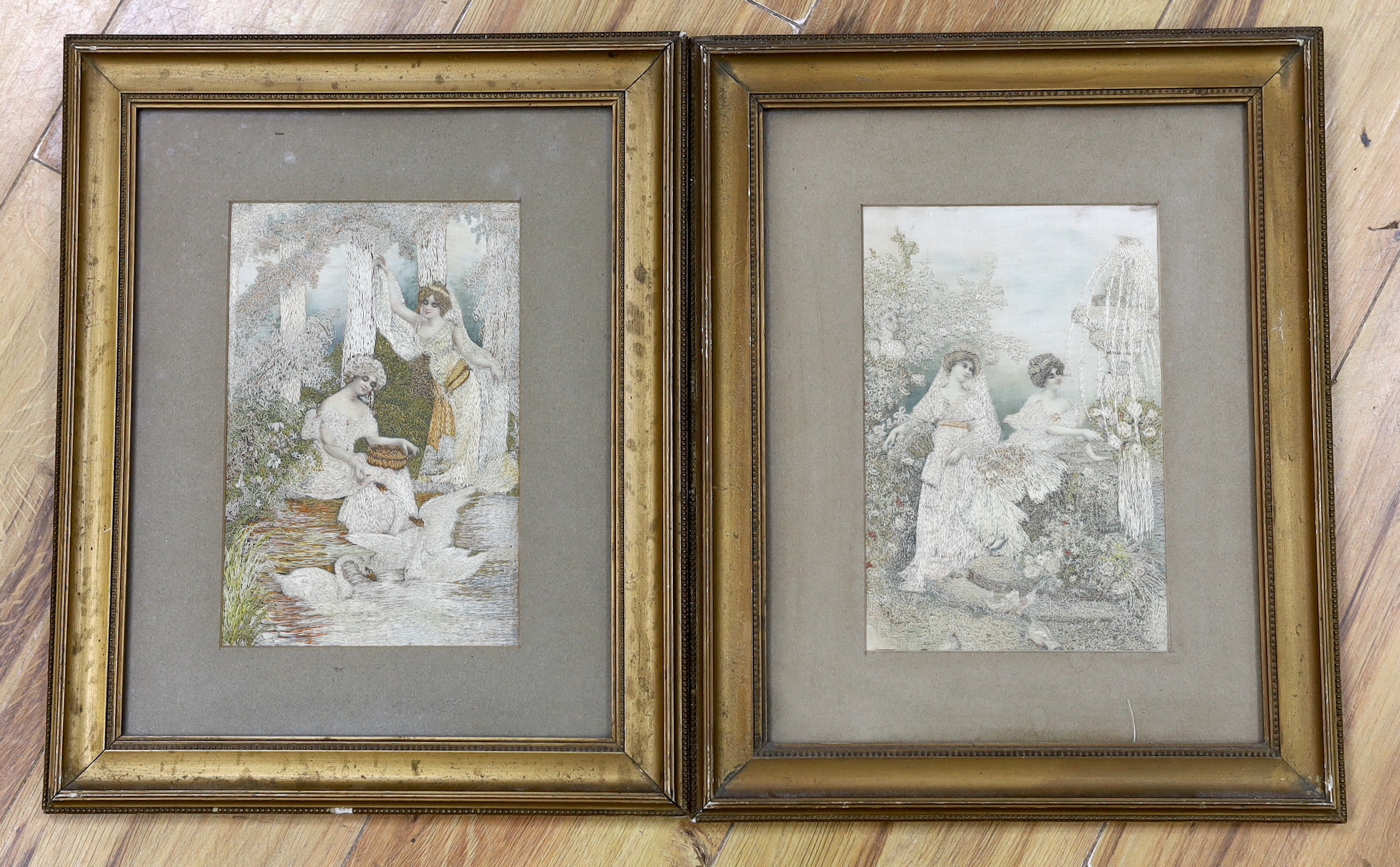 A pair of framed silk needlework panels, one of two ladies feeding a swan, the other of them cutting flowers in a garden, 13.5cm wide x 22.5cm high